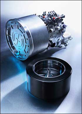 flywheel-system หน้าตาระบบ flywheel ที่ติดตั้งในรถยนต์ flywheel สีดำที่ทำจาก carbon fiber นั้นจะหมุนเก็บพลังงานอยู่ภายในกล่องเหล็กสูญญากาศ